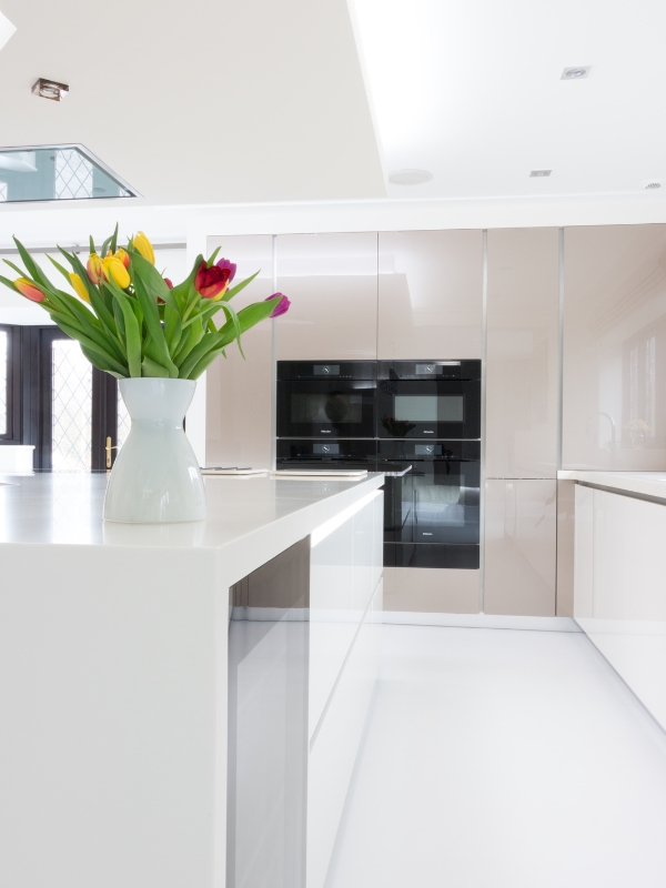 A home kitchen with white Corian countertops