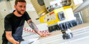 DFMK Employee Inspecting Surface Material