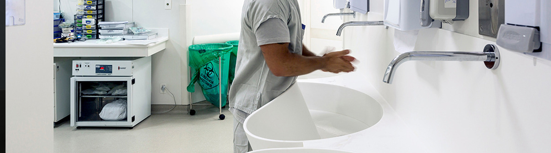 healthcare sink with healthcare wrking washing hands